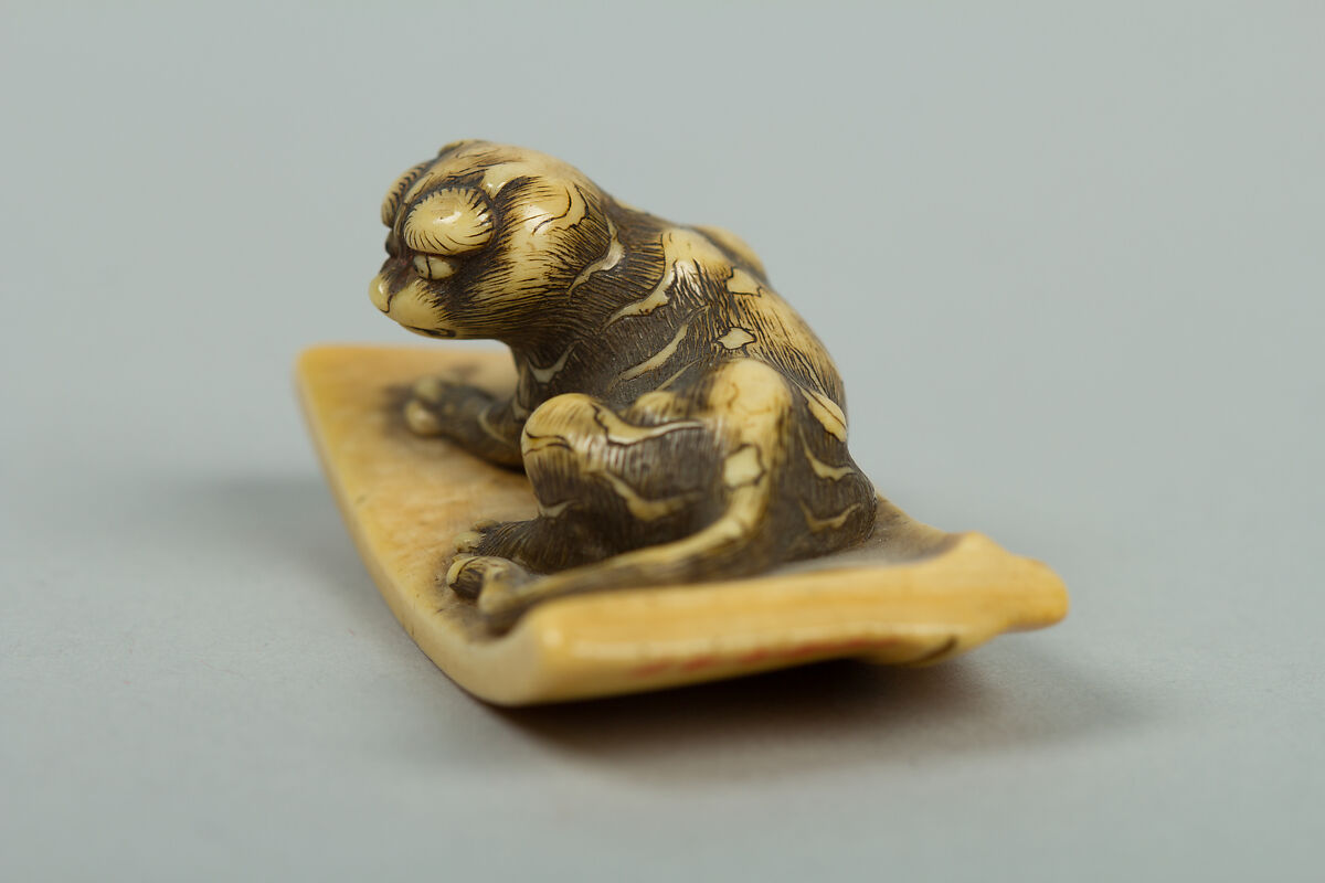 Netsuke of Tiger Lying on a Mat, Ivory, Japan