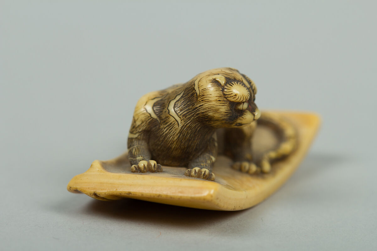Netsuke of Tiger Lying on a Mat, Ivory, Japan