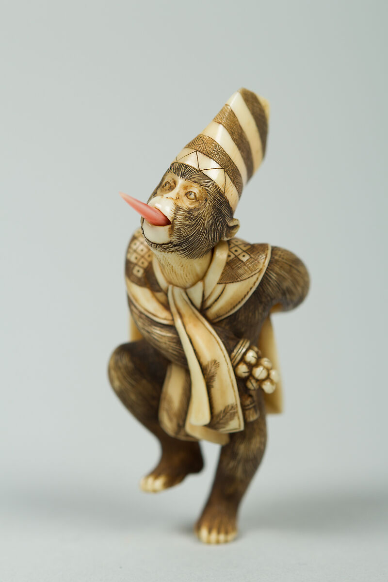 Netsuke of Monkey Wearing a Tall Cap and Carrying a Fan, Ivory, Japan 