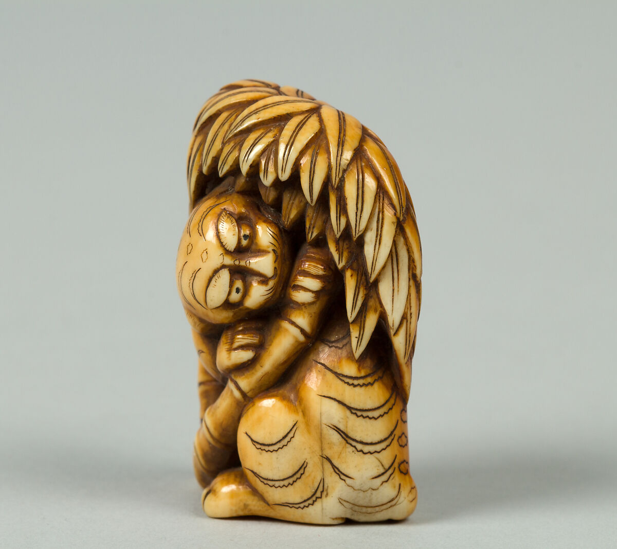 Netsuke of Tiger under a Bamboo Tree, Ivory, Japan 