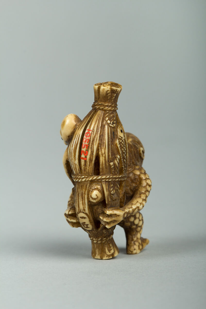 Netsuke of Monkey Carrying an Octopus Bound in Bamboo on His Back, Ivory, Japan