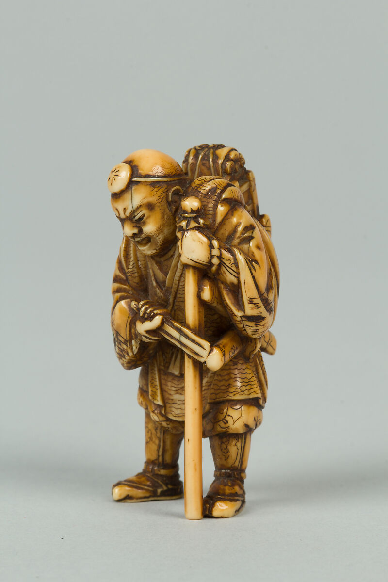 Netsuke of Old Man with a Pack on His Back, Ivory, Japan 