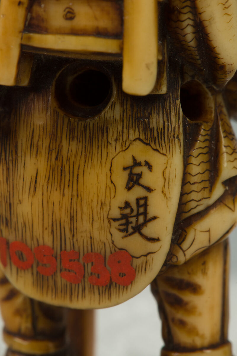 Netsuke of Old Man with a Pack on His Back, Ivory, Japan