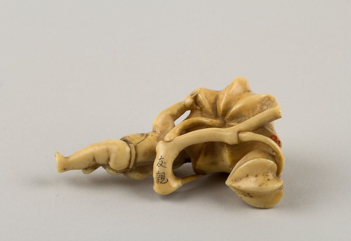 Netsuke of Boy Carrying a Branch of Fruit, Ivory, Japan