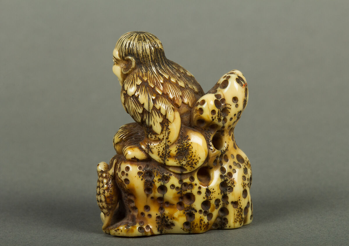 Netsuke of Old Man Sitting on a Rock, Ivory, Japan