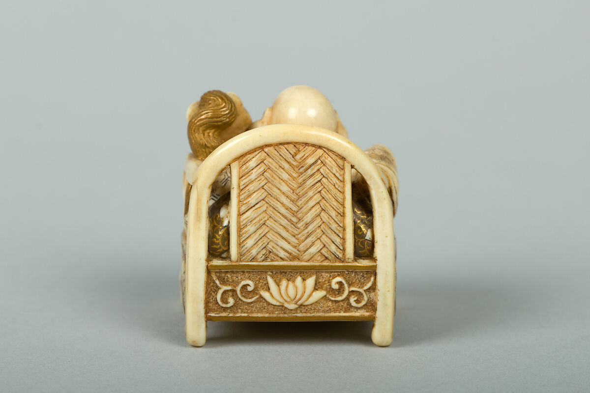 Netsuke of Hotei Seated in an Armchair, Ivory ornamented with lacquer, Japan