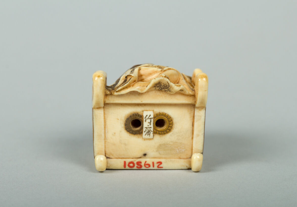 Netsuke of Hotei Seated in an Armchair, Ivory ornamented with lacquer, Japan