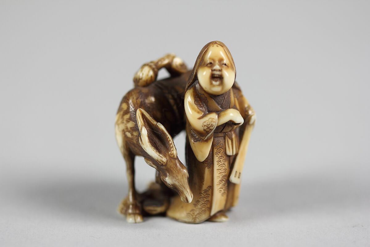 Netsuke of Female Figure (Okame) with a Deer, Ivory, Japan 