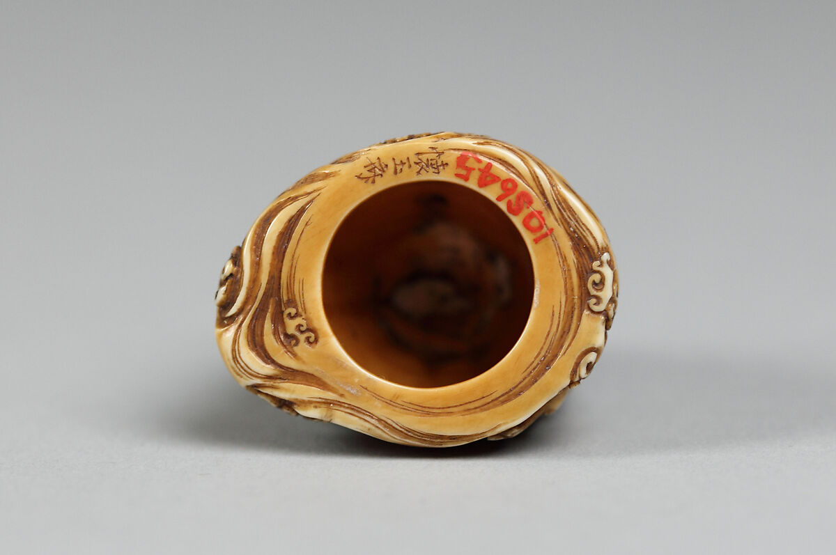 Netsuke in the form of a Bell Ornamented with Waves and Figures, Ivory, Japan