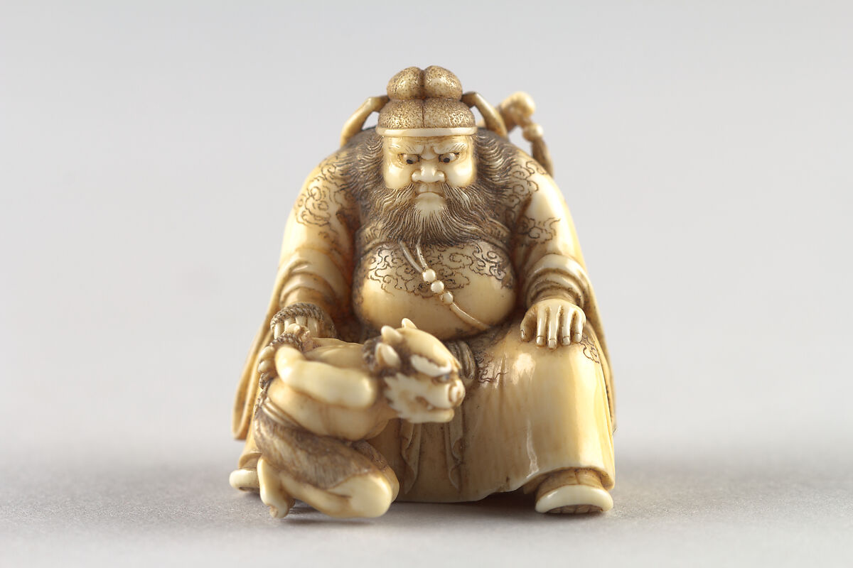 Netsuke of Shoki Holding a Demon by a Cord, Ivory, Japan 