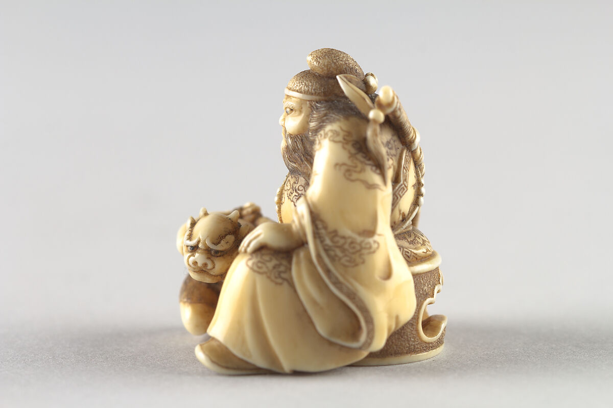 Netsuke of Shoki Holding a Demon by a Cord, Ivory, Japan