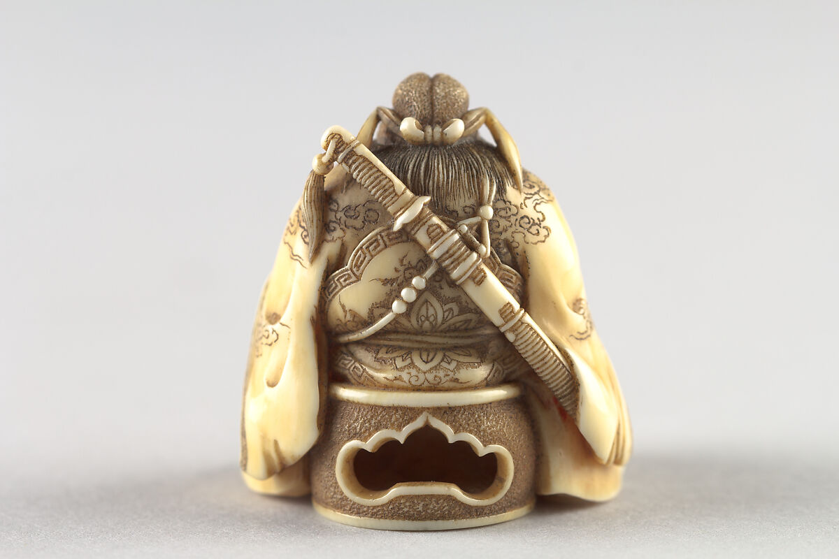 Netsuke of Shoki Holding a Demon by a Cord, Ivory, Japan