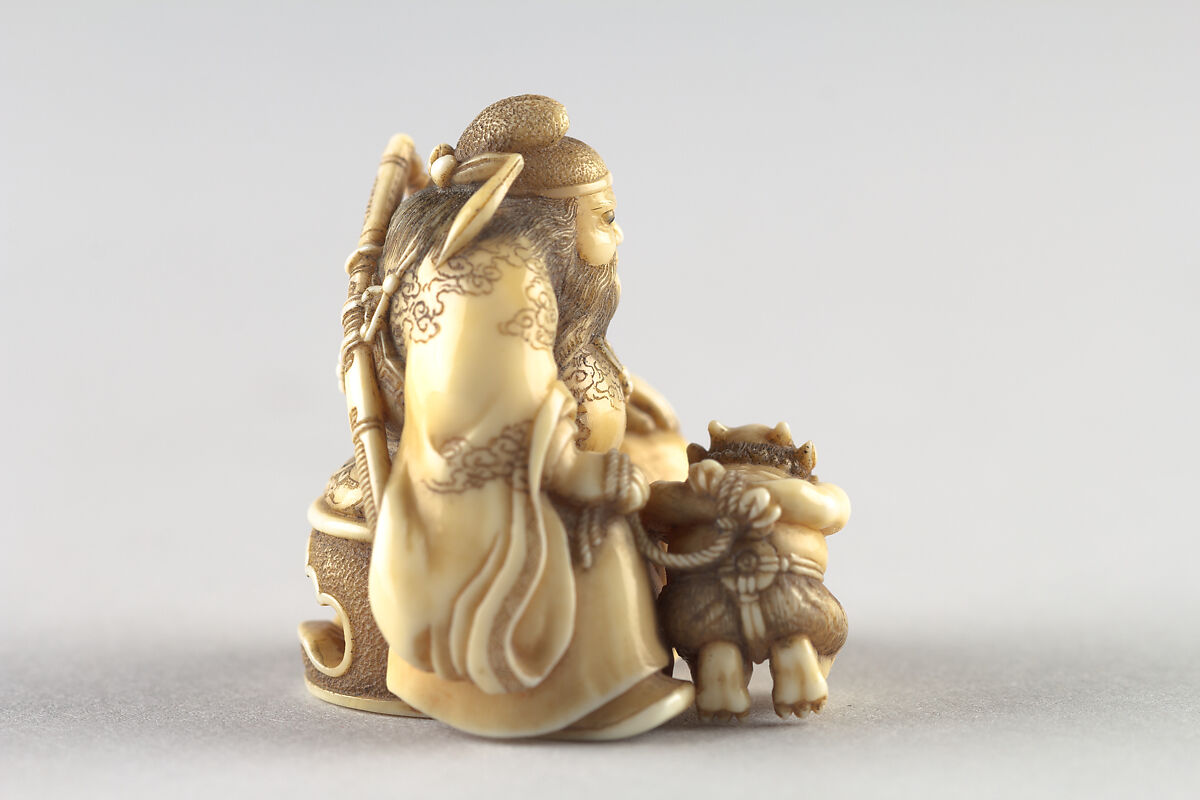 Netsuke of Shoki Holding a Demon by a Cord, Ivory, Japan