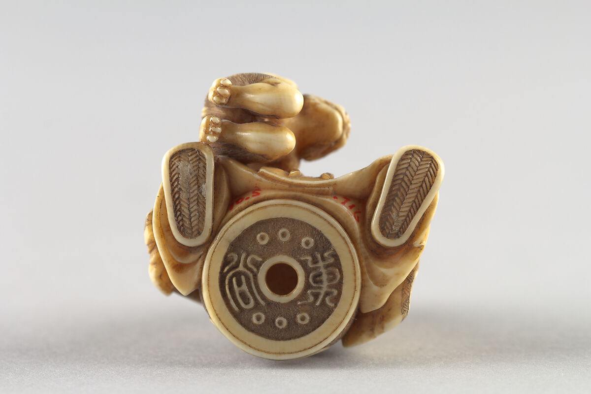 Netsuke of Shoki Holding a Demon by a Cord, Ivory, Japan