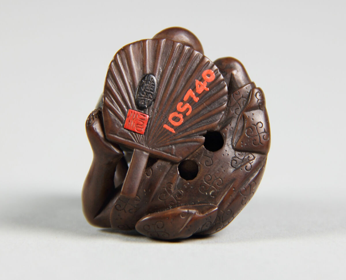 Netsuke of a Man Holding a Small Bottle in One Hand and Drinking from a Cup, Wood, Japan