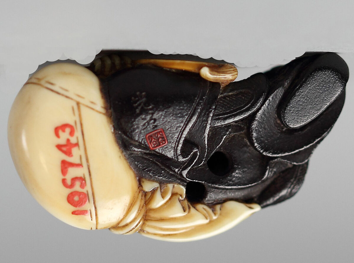 Netsuke of Hotei with a Fan, Wood and ivory, Japan