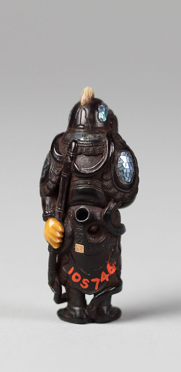 Netsuke of Bishamon, Black wood with ivory face and hands and inlaid ornamentation, Japan
