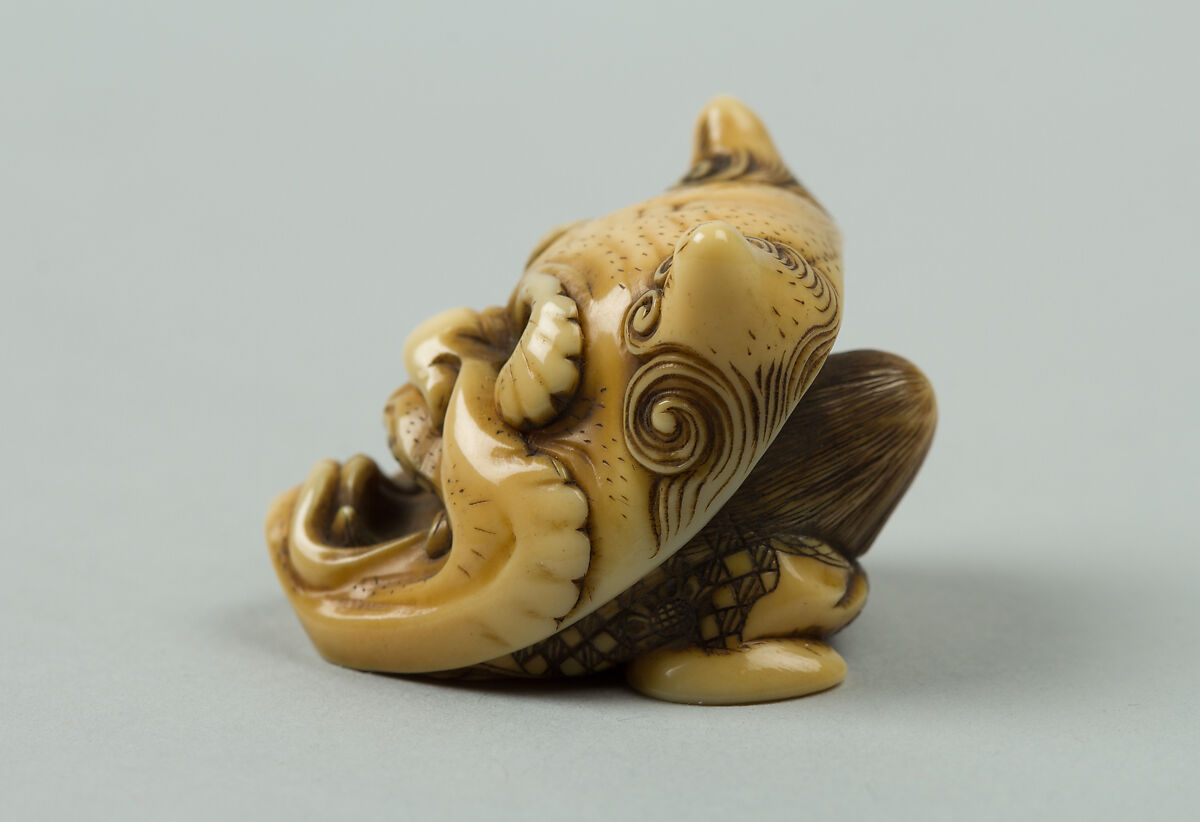 Netsuke of Okame under a Demon Mask, Ivory, Japan
