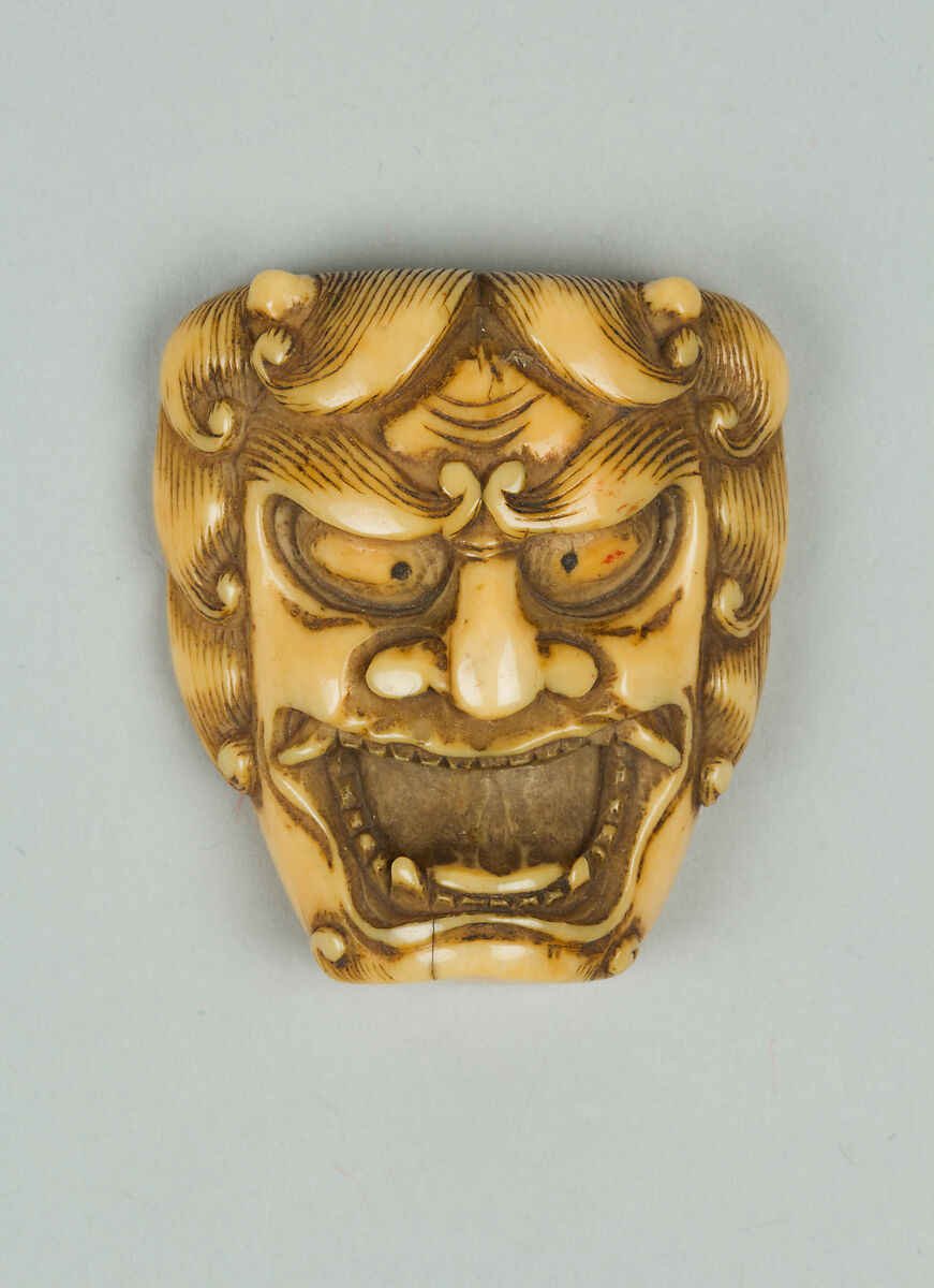 Netsuke of Mask of a Man with Open Mouth and Curly Hair, Ivory, Japan 