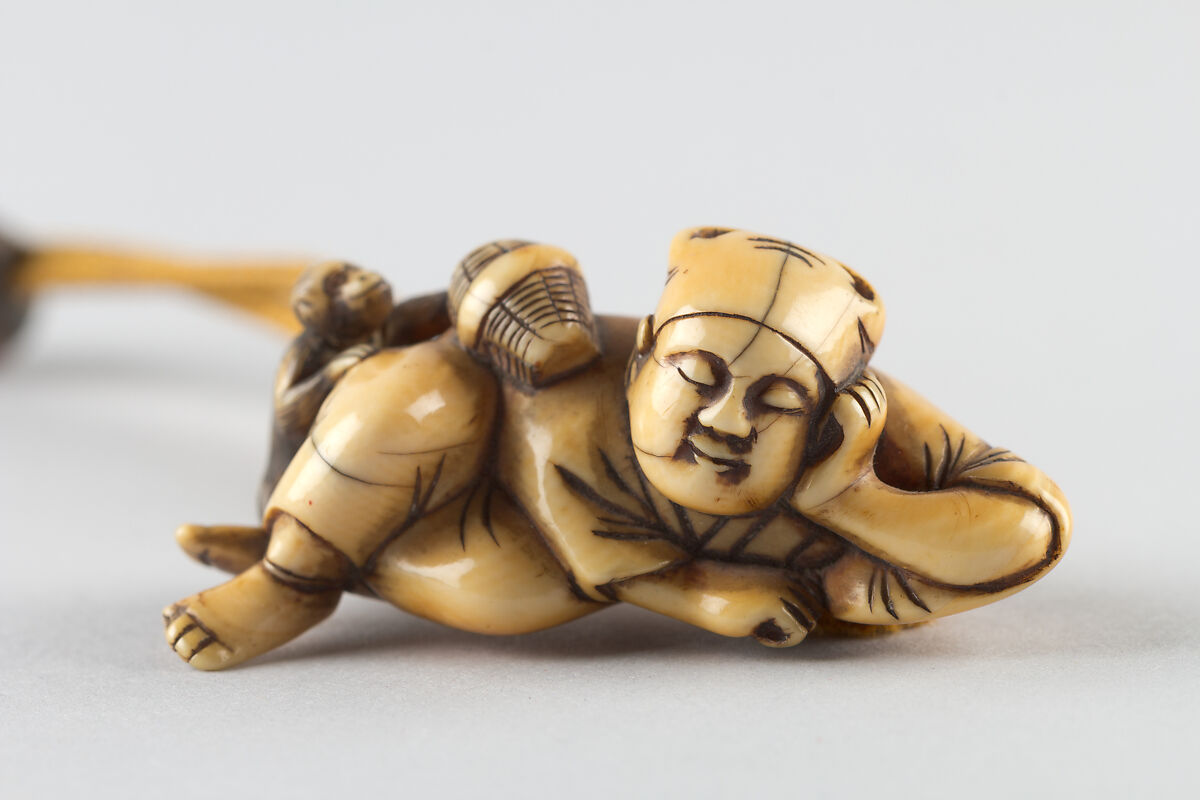 Netsuke of a Man Sleeping while Monkey Steals Contents of Basket, Ivory, Japan 
