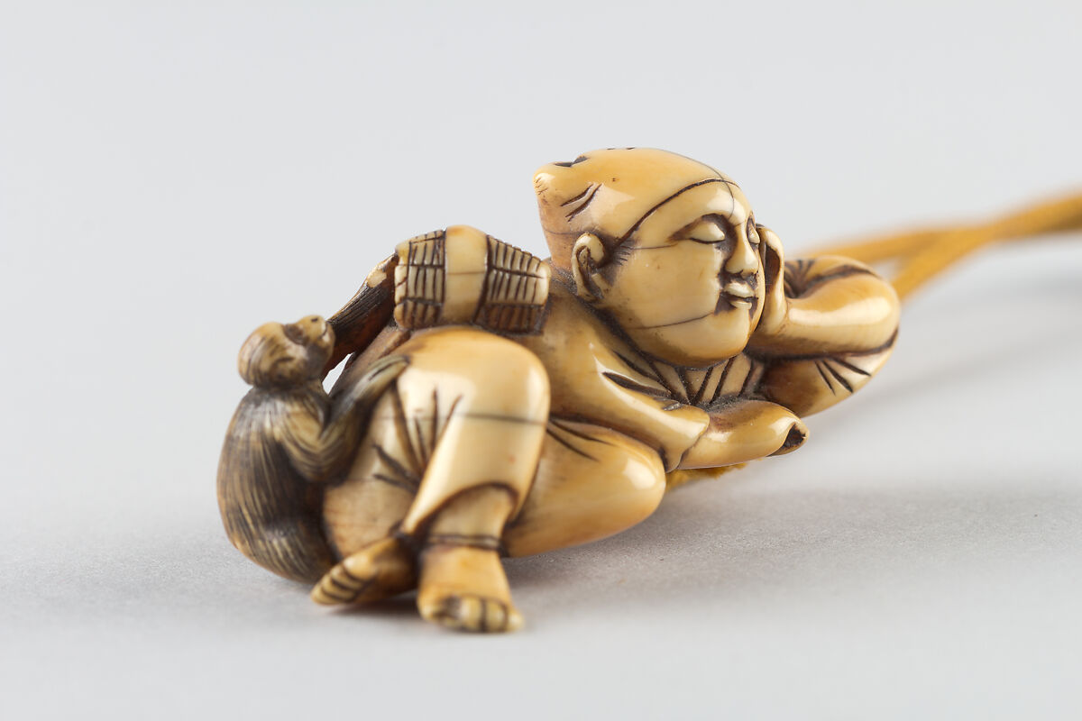 Netsuke of a Man Sleeping while Monkey Steals Contents of Basket, Ivory, Japan