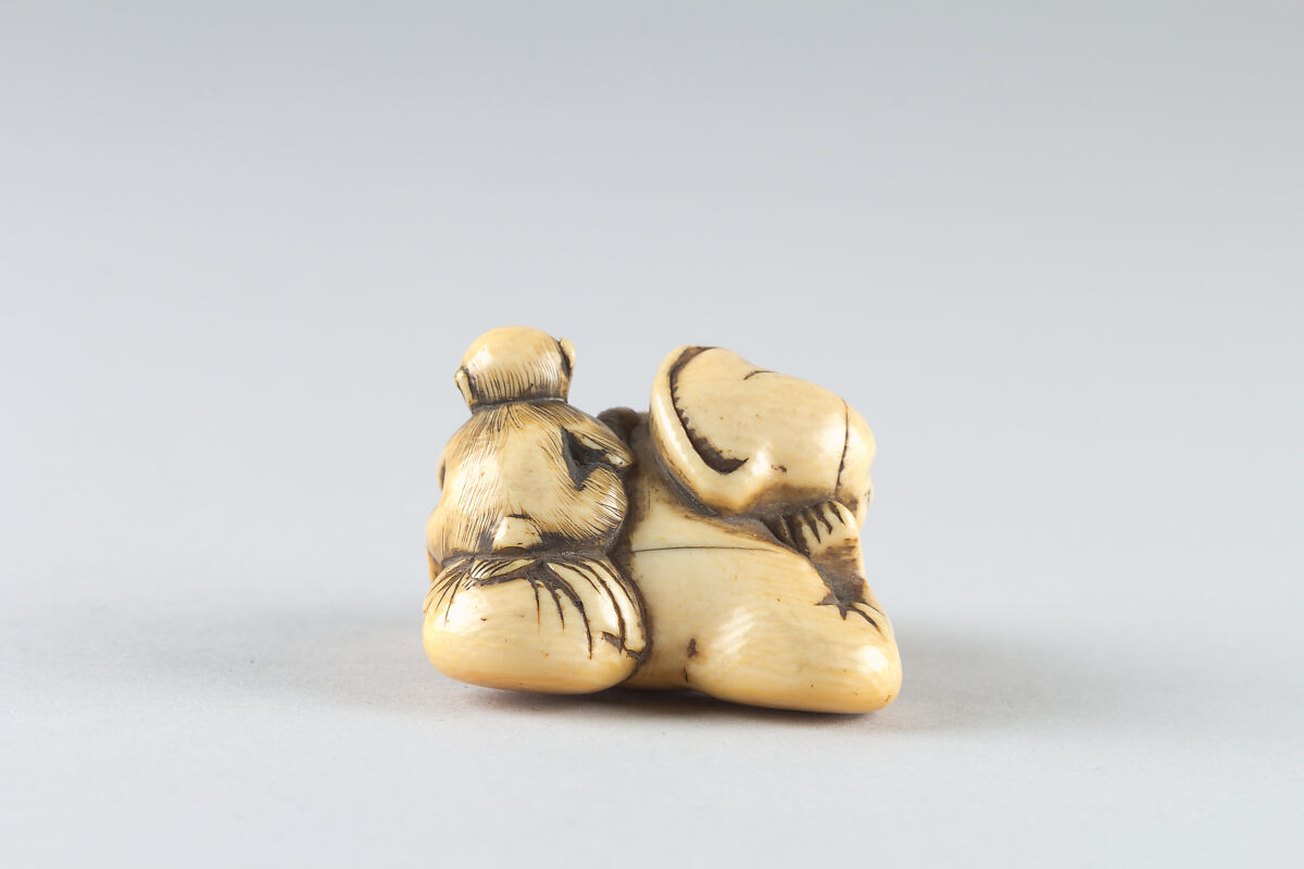 Netsuke of a Man Sleeping while Monkey Steals Contents of Basket, Ivory, Japan