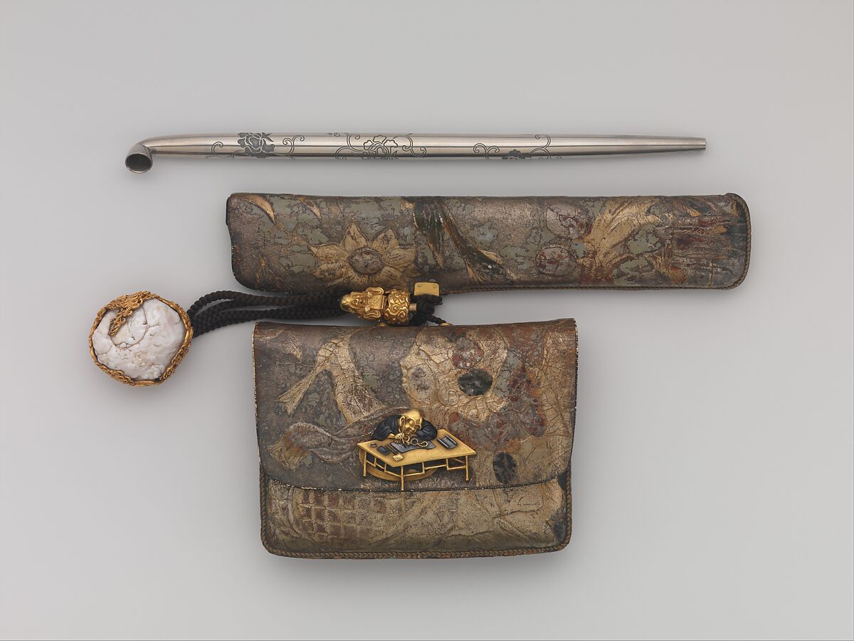 Tobacco Pouch and Pipe with Netsuke of Freshwater Pearl in Gold Mount, Pouch: Dutch embossed leather with silver foil, and color<br/>Clasp: gold, shakudō and shibuichi<br/>Ojime: gold<br/>Netsuke: freshwater pearl and gold<br/>Pipe: metal<br/>Pipe case: Dutch embossed leather with silver foils, and color, Japan