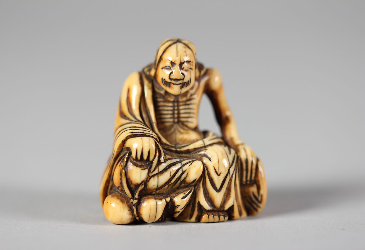 Netsuke of Old Man Seated on a Rock, Ivory, Japan 