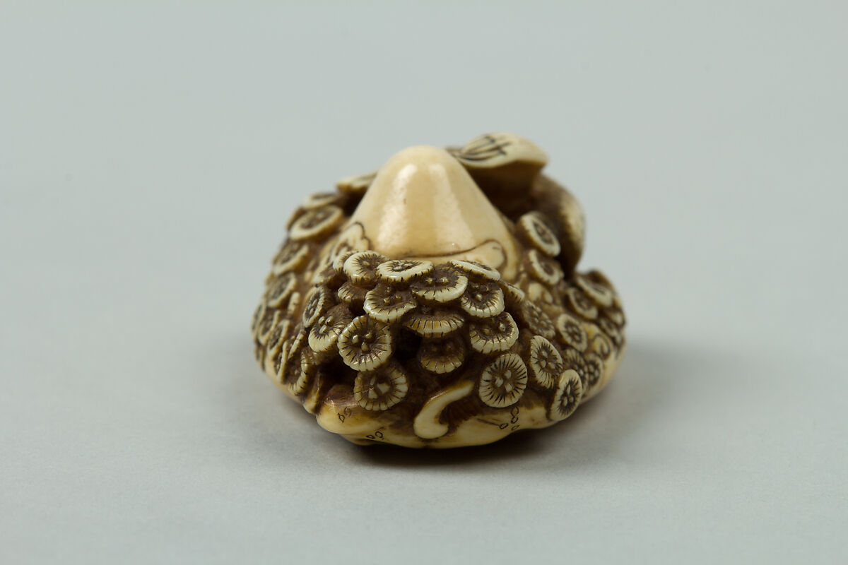 Netsuke of Mountain with Flowers and a Bird, Ivory, Japan