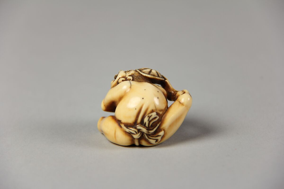 Netsuke of Acrobat Removing his Hat with His Foot, Ivory, Japan