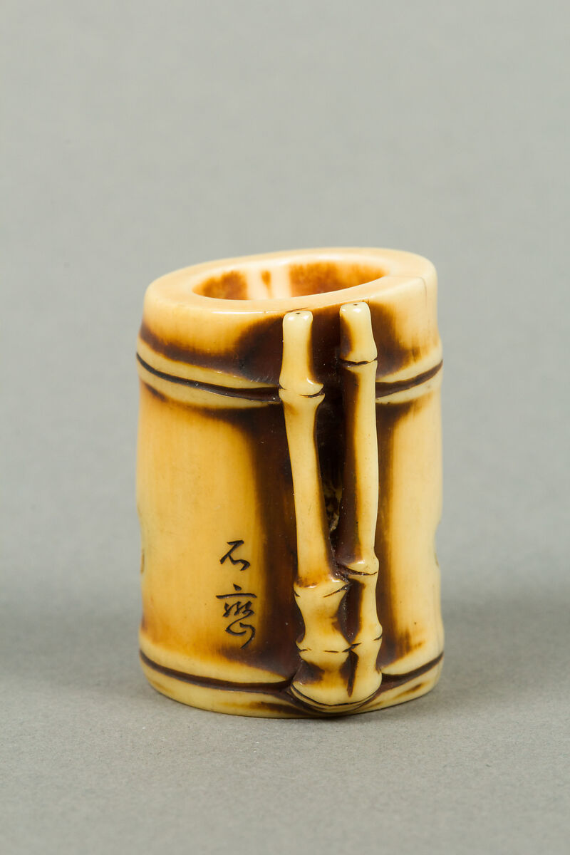 Netsuke of Section of Bamboo Containing Two Men, Ivory, Japan