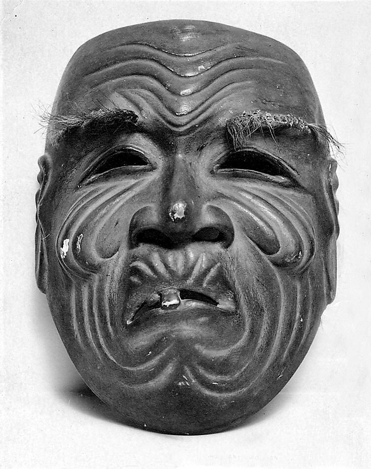 Kyogen mask, Carved wood and brocade bag, Japan 