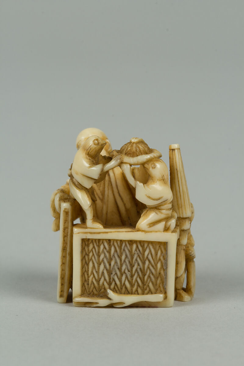 Netsuke of Man Training Birds, Ivory, Japan