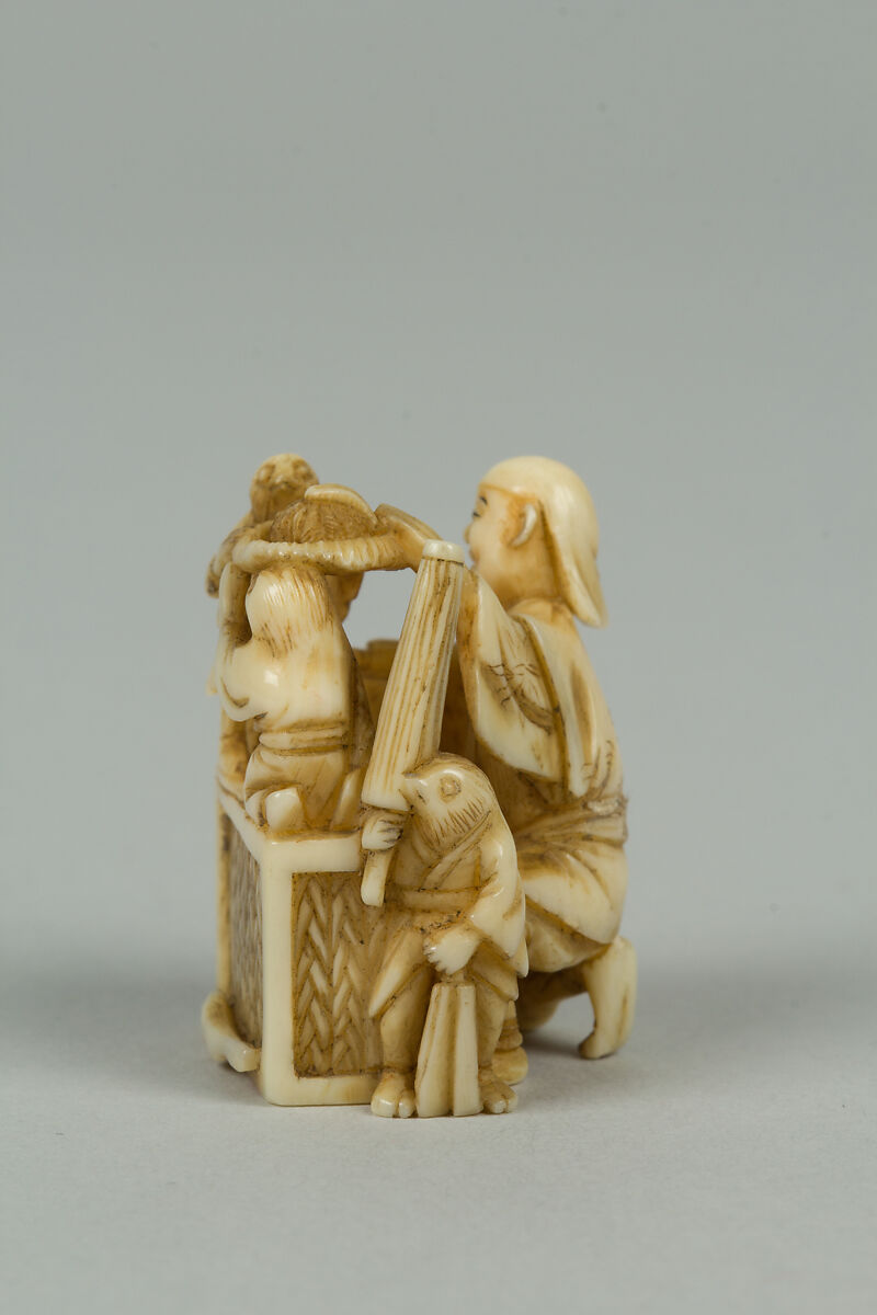 Netsuke of Man Training Birds, Ivory, Japan