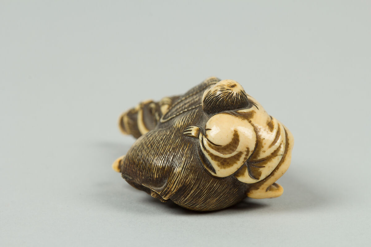Netsuke of Boy Climbing over the Back of a Cow, Ivory, Japan