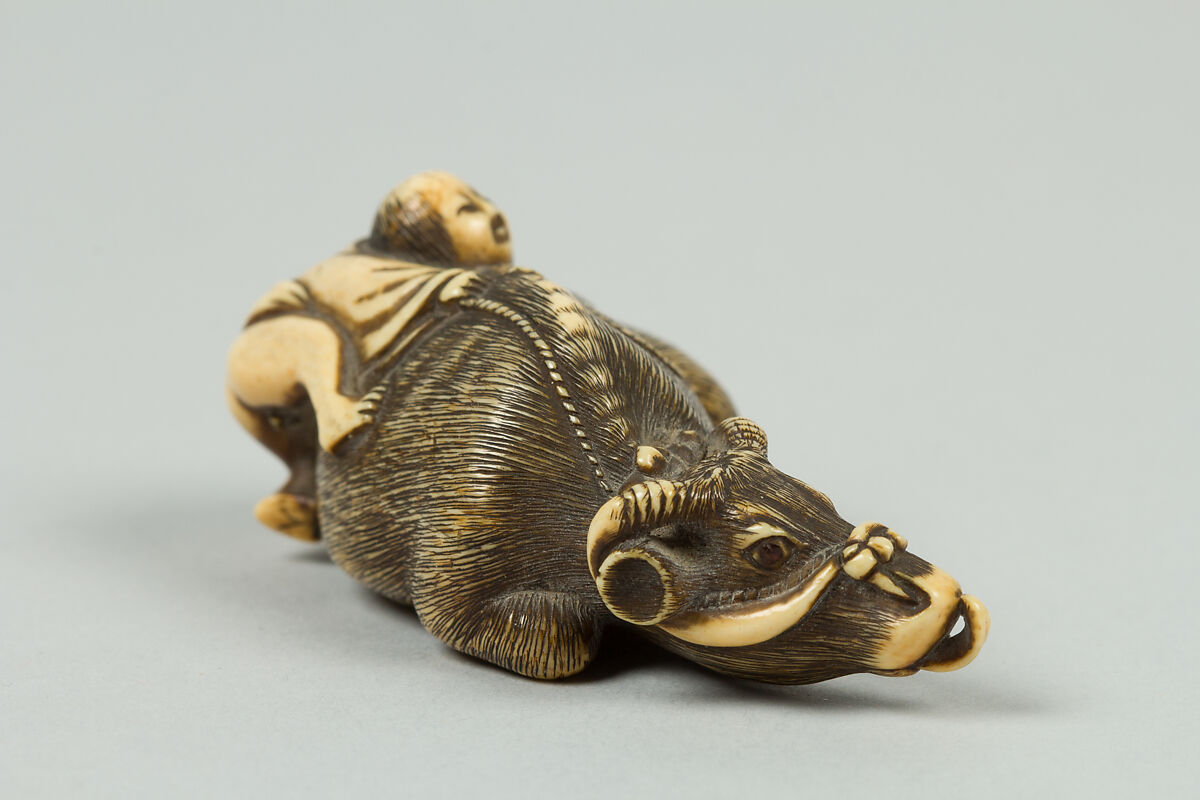 Netsuke of Boy Climbing over the Back of a Cow, Ivory, Japan