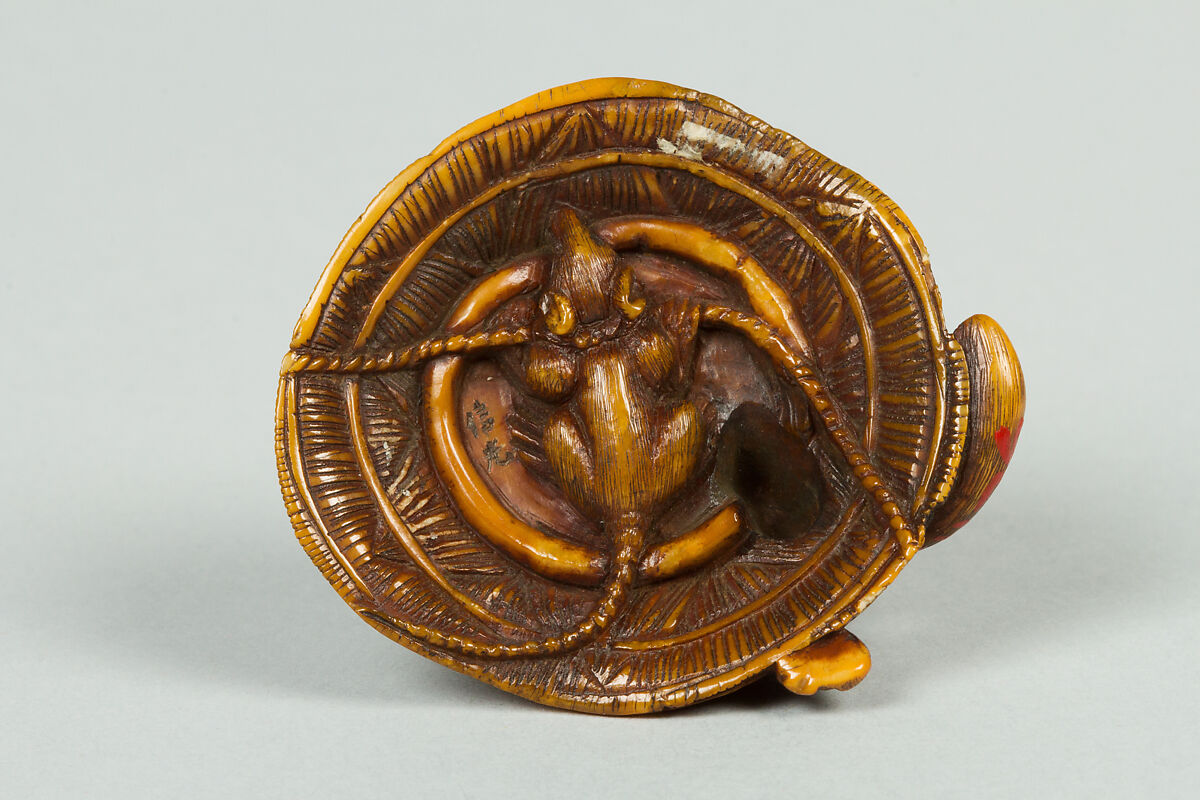 Netsuke of Animal on a Straw Mat under which is a Mouse, Ivory, Japan