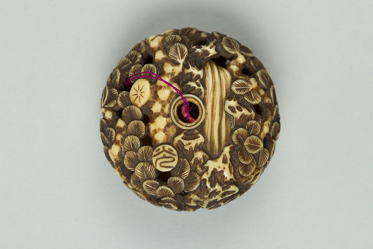 Netsuke, Ivory carved in openwork and ornamented in gold, Japan