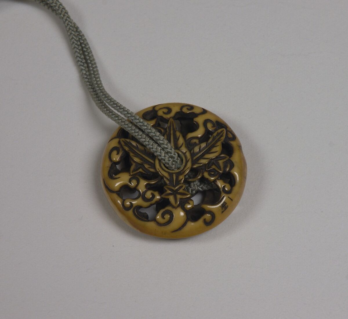 Netsuke of Chrysanthemum, Ivory carved in openwork, Japan