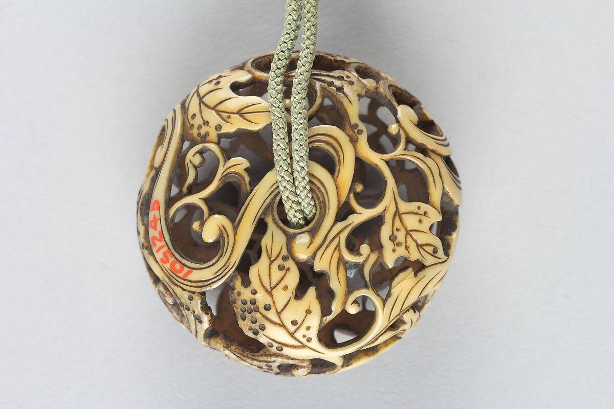 Netsuke of Water and Chrysanthemum (Kikusui), Ivory carved in openwork, (Ryūsa), Japan