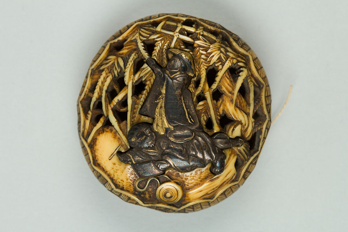 Netsuke, Ivory carved in openwork, ornamented with silver, Japan 