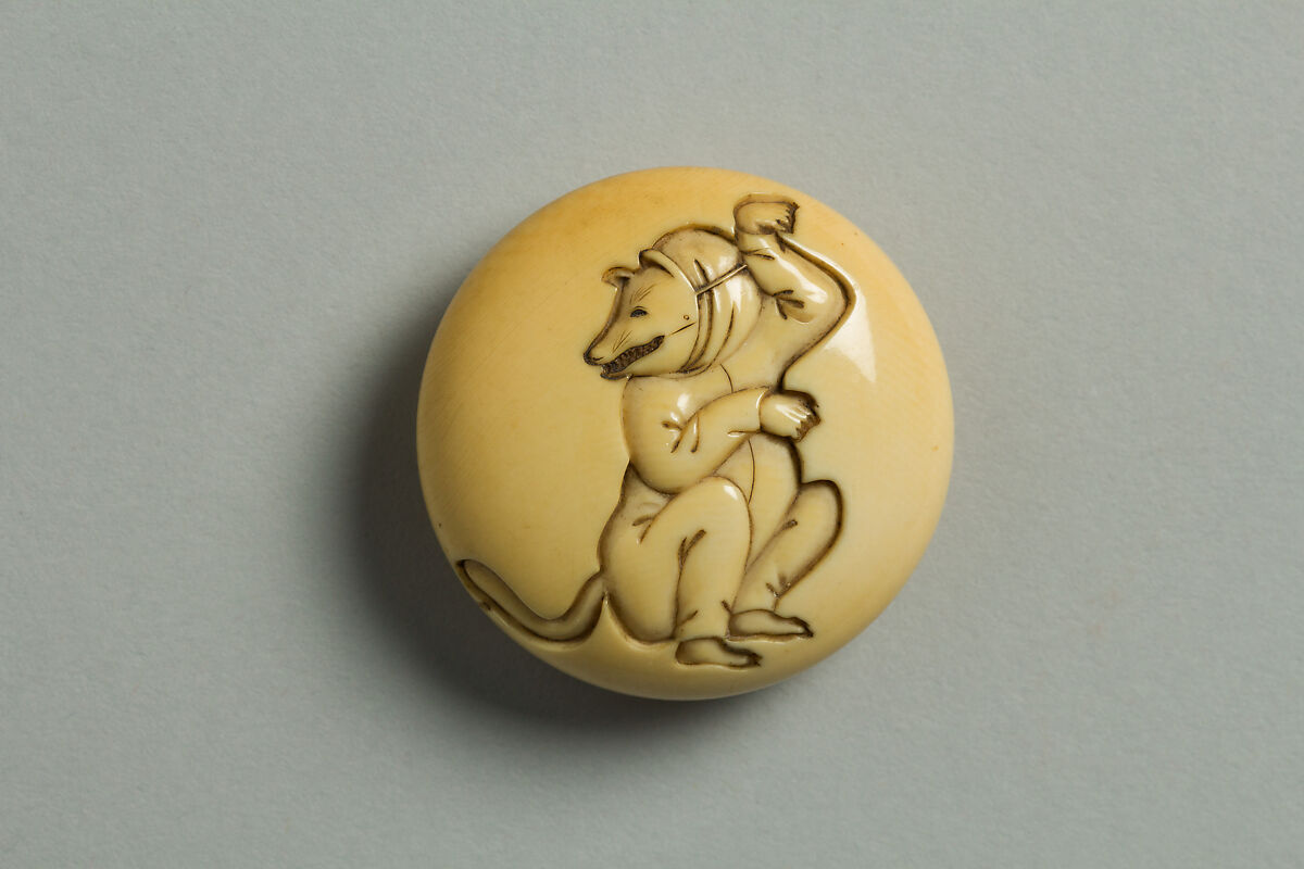 Circular Netsuke with Actor Dressed as Fox; reverse: Trap with Mouse, Ivory, Japan 