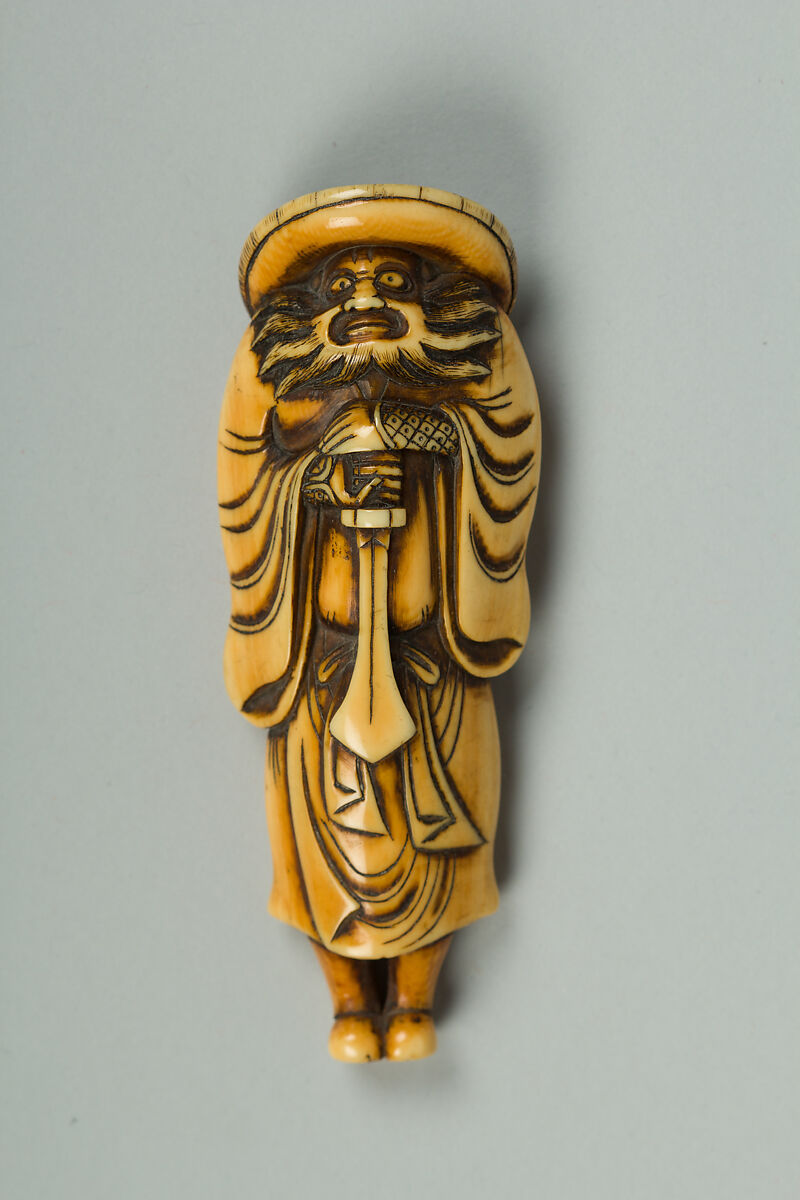 Netsuke of a Man Carrying a Sword, Ivory, Japan 