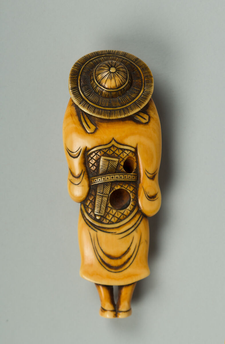 Netsuke of a Man Carrying a Sword, Ivory, Japan