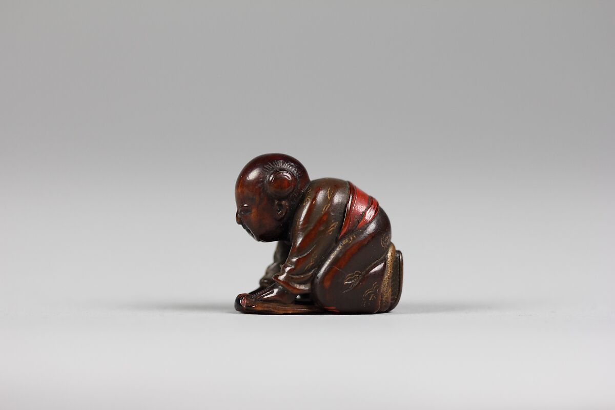 Netsuke, Wood lacquered and decorated with gold, Japan
