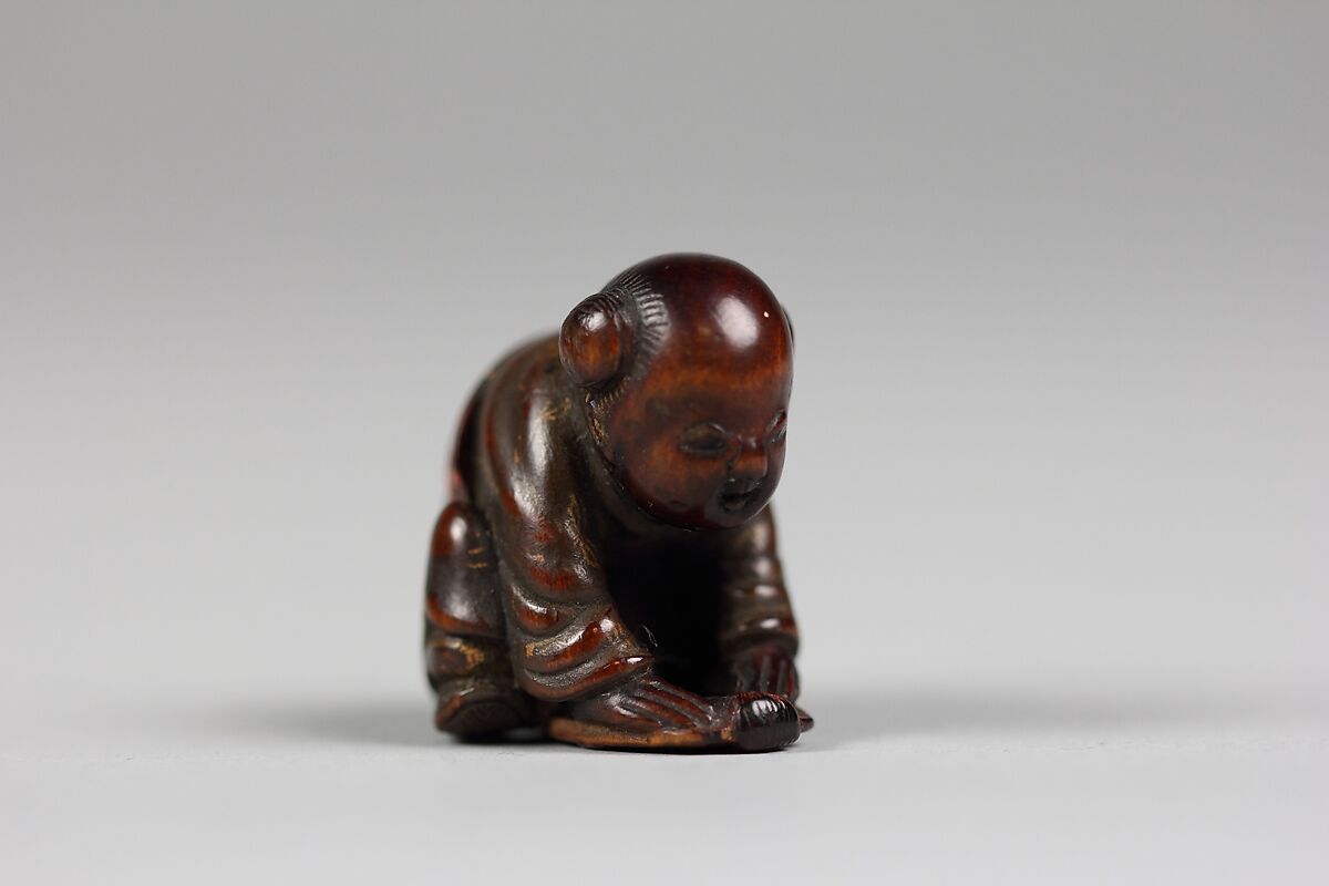 Netsuke, Wood lacquered and decorated with gold, Japan 