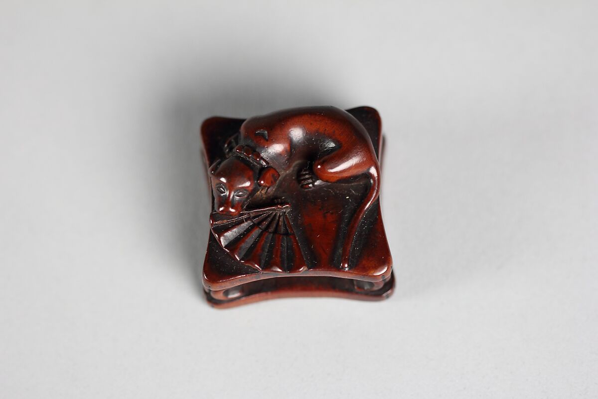 Netsuke of Dog and Fan on a Bench, Wood, Japan