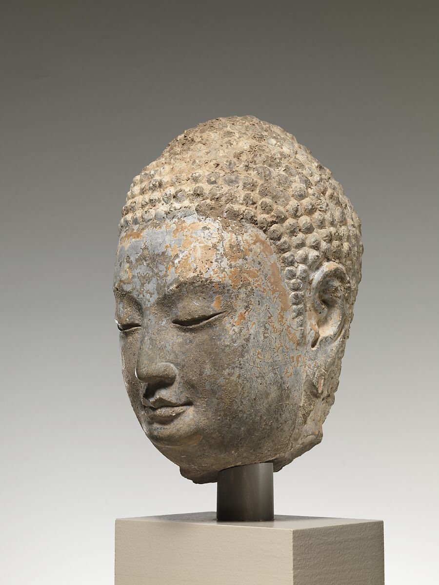 Head of a Buddha, Limestone with traces of pigment and gilding, China