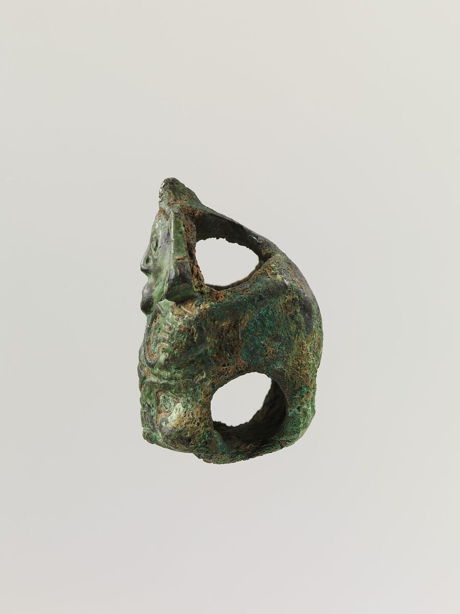 Fitting in the shape of a man grasping a tiger head, Bronze, China