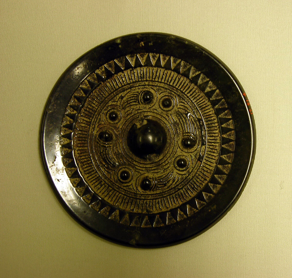 Mirror with knobs and swirls, Bronze with black patina, China 